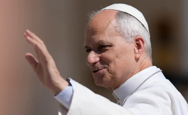 Pope Leo XIV waves as he arrives for his weekly general audience in St. Peter's Square at the Vatican, Wednesday, May 27, 2026. (AP Photo/Alessandra Tarantino) Pope AI encyclical