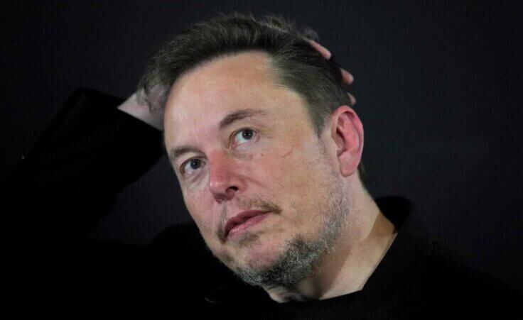 FILE - Elon Musk appears at an event with Britain's Prime Minister Rishi Sunak in London, on Nov. 2, 2023. According to Musk, the first human received an implant from his computer-brain interface company Neuralink over the weekend. (AP Photo/Kirsty Wigglesworth, Pool, File)