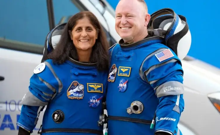 NASA astronauts Suni Williams, left, and Butch Wilmore stand together for a photo enroute to the launch pad at Space Launch Complex 41 Wednesday, June 5, 2024, in Cape Canaveral, Fla., for their liftoff on the Boeing Starliner capsule to the international space station. (AP Photo/Chris O'Meara, File)