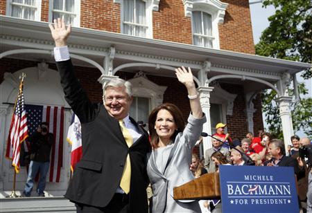Michele Bachmann waves with her husband Marcus after she addressed a gathering of supporters to formally launch her campaign for the 2012 Republican presidential nomination in her childhood hometown of Waterloo, Iowa, June 27, 2011. (Credit: Reuters/Jeff Haynes)