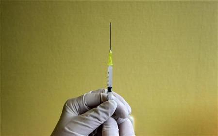 A nurse prepares a flu vaccine shot at a hospital in Budapest in a file photo. (Credit: Reuters/Karoly Arvai)