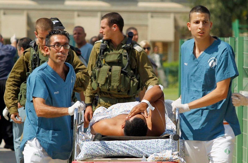Israeli medics evacuate a person wounded in one of several attacks in the Arava desert, to the Soroka hospital in Beersheba, southern Israel, Thursday, August 18, 2011. (Credit: Reuters/Ilan Assayag)