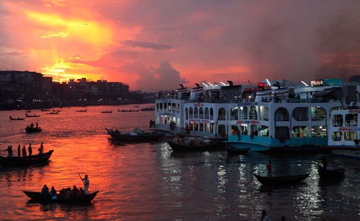 Boats are seen as they wait to carry passengers ahead of the Muslim holiday Eid al-Fitr during dusk on the Buriganga river in Dhaka August 25, 2011 (Credit: Reuters/Andrew Biraj)