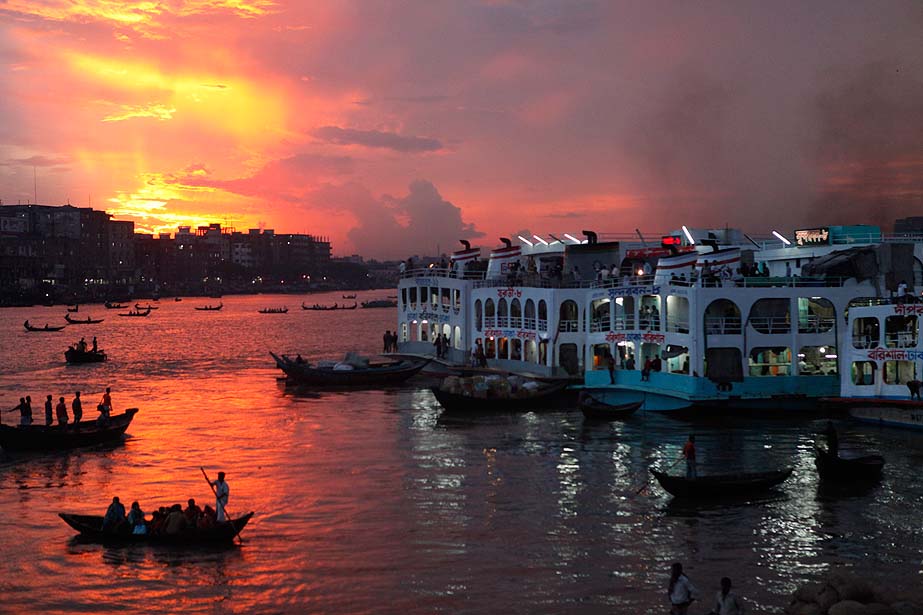 Boats are seen as they wait to carry passengers ahead of the Muslim holiday Eid al-Fitr during dusk on the Buriganga river in Dhaka August 25, 2011 (Credit: Reuters/Andrew Biraj)