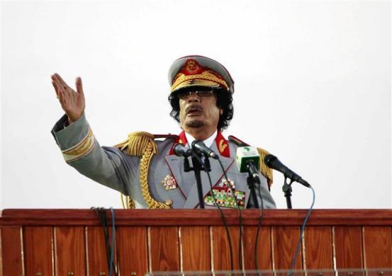 Libyan leader Muammar Gaddafi speaks during a ceremony to mark the 40th anniversary of the evacuation of the American military bases in the country, in Tripoli, June 12, 2010 (Credit: Ismail Zetouny)