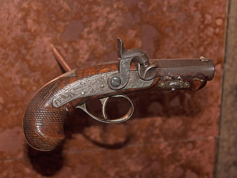 The Philadelphia Derringer pistol Booth used to murder Lincoln, on display at the museum in Ford's Theatre (Credit: user Wknight94 via en.wikipedia.org)