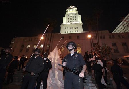 Los Angeles police officers stand guard as they evict protesters from the Occupy LA encampment outside City Hall in Los Angeles November 30, 2011. (Credit: Reuters/Lucy Nicholson)