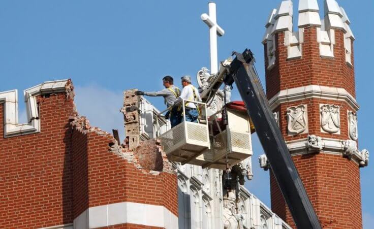 An eathquake late Saturday night caused extensive damage to the towers (turrets) atop Benedictine Hall, the most prominent structure on the campus of St. Gregory's University in Shawnee (Credit: The Oklahoman/Jim Beckel)