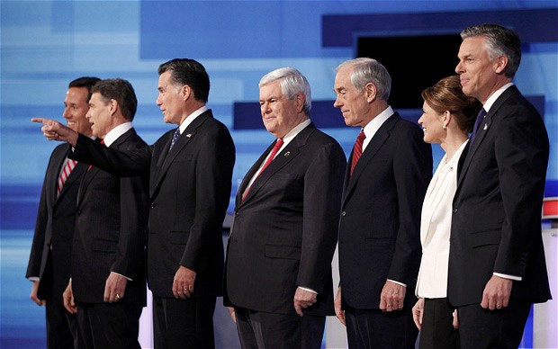 Republican presidential candidates (L-R) Rick Santorum, Rick Perry, Mitt Romney, Newt Gingrich, Ron Paul, Michele Bachmann and Jon Huntsman Photo at last presidential debate of 2011 in Sioux City, Iowa (Credit:Jeff Haynes)