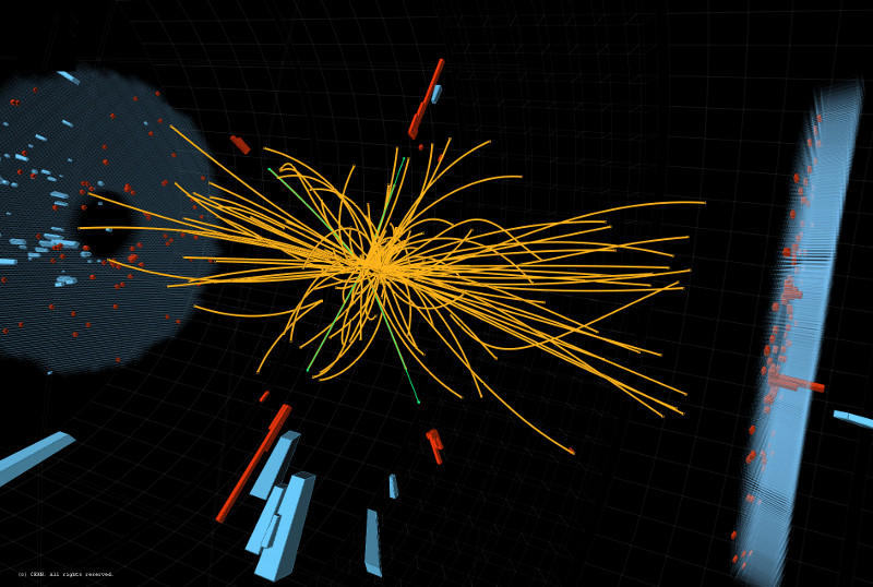 Two high-energy photons shown as red towers are smashed together in the LHC. The yellow lines are the measured tracks of other particles produced in the collision -- possible evidence in the hunt for the Higgs Boson (Credit: CERN/Thomas McCauley, Lucas Taylor)
