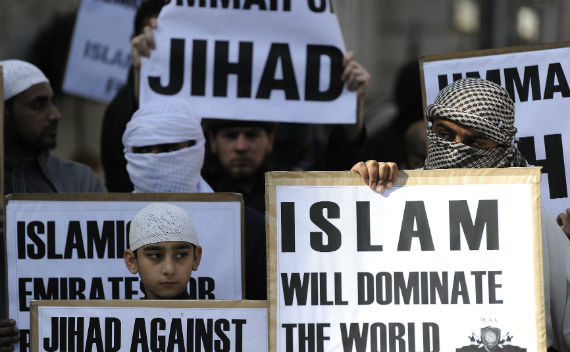 Members of an Islamist group hold placards outside the U.S. embassy in London on September 11, 2011 during a ceremony to mark the 10th anniversary of the 9/11 attacks on the United States (Credit: Reuters/Paul Hackett)