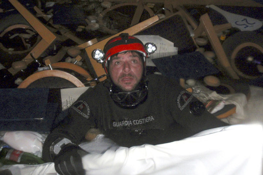 In this photo released by the Italian Coast Guard, a coast guard scuba diver makes his way through floating pieces of furniture inside the cruise ship Costa Concordia on January 15 2012 after it ran aground off the tiny Tuscan island of Giglio Italy (Credit: Italian Coast Guard)