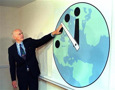 Leonard Reiser, chairman of the Bulletin of the Atomic Scientists and member of the Manhattan Project adjusts the Doomsday Clock (Credit: Reuters)