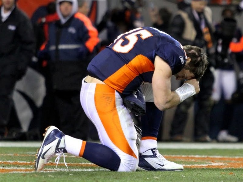 Denver Broncos quarterback Tim Tebow prays after the Broncos defeated the Pittsburgh Steelers in overtime in the NFL AFC wildcard playoff football game in Denver, Colorado, January 8, 2012 (Credit: Reuters/Marc Piscotty)