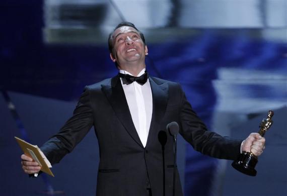 French actor Jean Dujardin accepts the Oscar for Best Actor for his role in the film