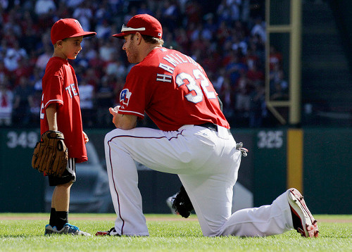 Josh Hamilton talks with Cooper Stone after ceremonial first pitch before game 1 of the ALDS (Credit: AP/Tony Gutierrez)