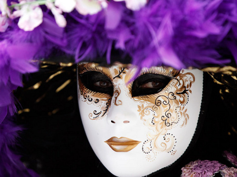 A person in a mask poses in Piazza San Marco during the Venetian Carnival in Venice, on February 11 2012 (Credit: Reuters/Stefano Rellandini)