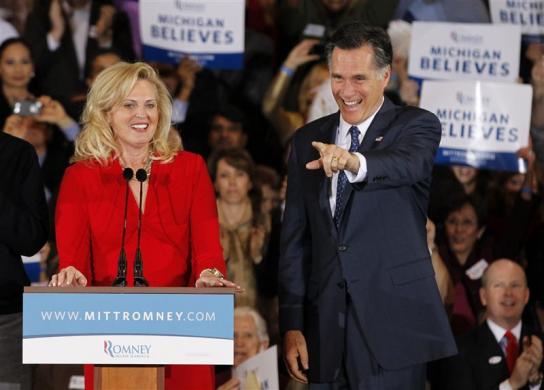 Mitt Romney is accompanied by his wife Ann as he prepares to address supporters at his Michigan primary night rally in Novi, Michigan, February 28, 2012 (Credit: Reuters/Mark Blinch)