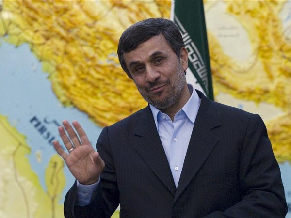 Iranian President Mahmoud Ahmadinejad jokes with journalists as he waits to meet with India's Minister for New and Renewable Energy Farooq Abdullah (not pictured) in Tehran March 4, 2012 (Credit: Reuters/Caren Firouz)