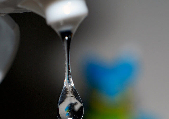 A close-up of a drop of a hand sanitizer from a squeeze bottle (Credit: enggul via Flickr)