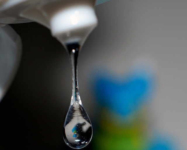 A close-up of a drop of a hand sanitizer from a squeeze bottle (Credit: enggul via Flickr)