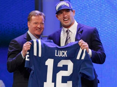 Quarterback Andrew Luck from Stanford University, holds up a jersey as he stands with NFL Commissioner Roger Goodell after being selected by the Indianapolis Colts as the number one overall pick in the 2012 NFL Draft in New York, April 26, 2012 (Credit: Reuters/Adam Hunger)