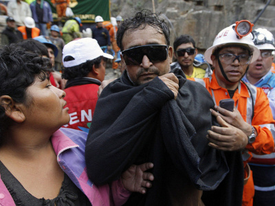 A rescued miner is escorted outside the mine Cabeza de Negro where he was trapped since April 5, in Ica, April 11, 2012 (Credit: Reuters/Mariana Bazo)