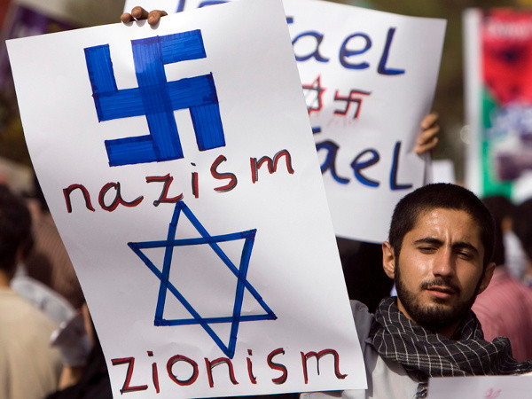 An Iranian man holds an anti-Israeli placard during a rally marking Qods (Jerusalem) day in Tehran September 18, 2009. Iran security forces clashed with supporters of opposition leader Mirhossein Mousavi and arrested at least 10 of them during annual anti-Israel rallies in Tehran on Friday, a witness said. Qods day, held on the last Friday of the Muslim holy fasting month of Ramadan, is observed as a show of support for the Palestinian people Credit: Reuters/Caren Firouz)