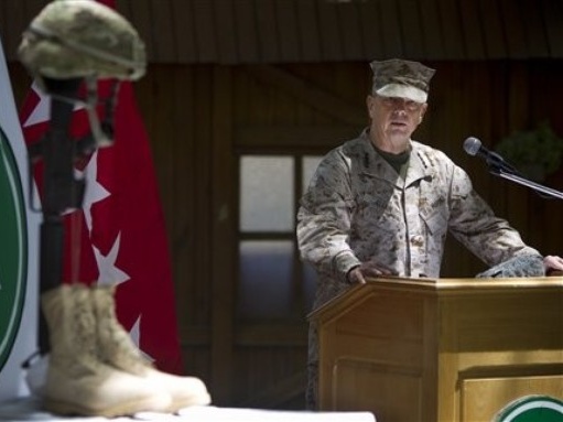 General John Allen the top U.S. commander in Afghanistan observes Memorial Day by reading a letter written by an American soldier to his family before he died earlier this year at the ISAF headquarters in Kabul Afghanistan Monday May 28 2012 (Credit: AP/Anja Niedringhaus)