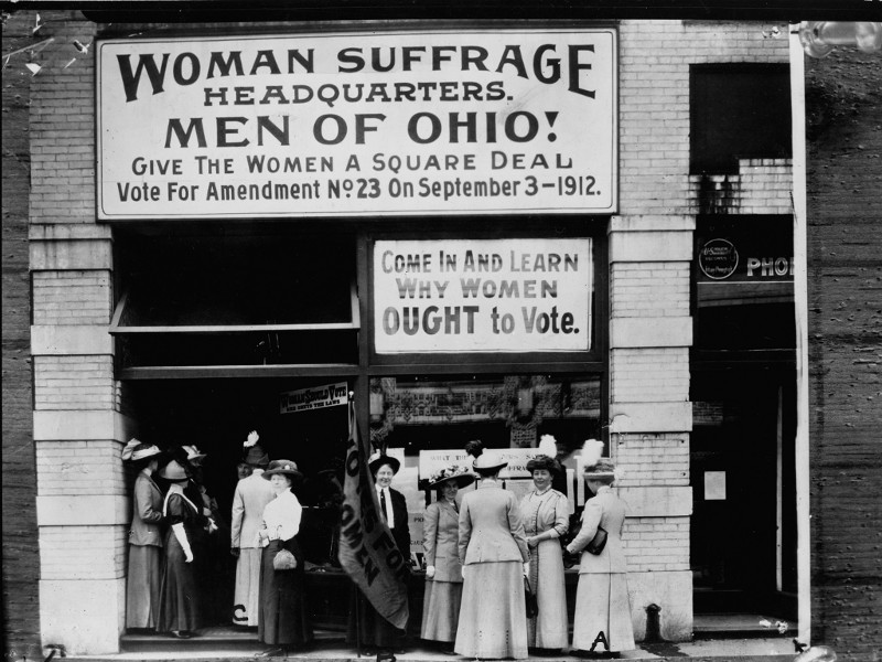 Woman suffrage headquarters in Upper Euclid Avenue, Cleveland--A. (at extreme right) is Miss Belle Sherwin, President, National League of Women Voters; B. is Judge Florence E. Allen (holding the flag); C. is Mrs. Malcolm McBride