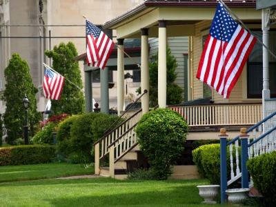 American flags flying from front porches (Credit: Cynthia Lindow via iStockphoto)