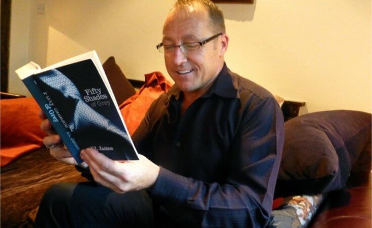 Manager of Damson Dene Hotel, Wayne Bartholomew replacing copies of the Gideon Bible with copies of racy best-seller Fifty Shades of Grey (Credit: Jonathan Denby)