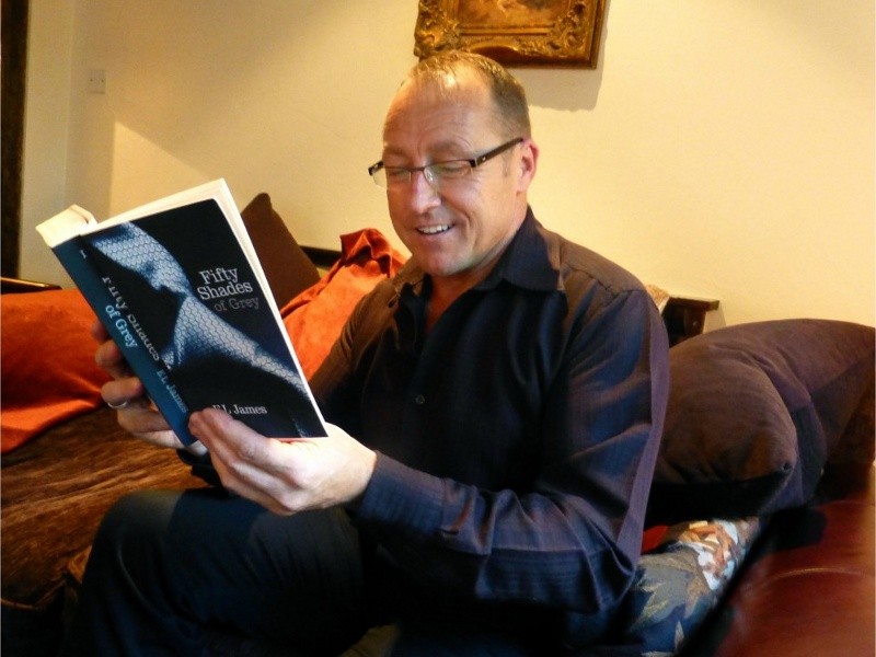 Manager of Damson Dene Hotel, Wayne Bartholomew replacing copies of the Gideon Bible with copies of racy best-seller Fifty Shades of Grey (Credit: Jonathan Denby)