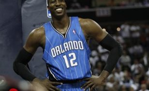 Orlando Magic center Dwight Howard (12) smiles in the second half against the Charlotte Bobcats during Game 4 of their NBA Eastern Conference playoff basketball series in Charlotte, North Carolina April 26, 2010 (Credit: Reuters / Jason Miczek)
