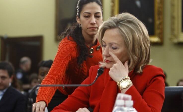 Huma Abedin, an aide to Secretary of State Hillary Clinton, hands her a note during a House Appropriations Committee hearing on Capitol Hill in Washington, March 10, 2011 (Credit: Reuters / Hyungwon Kang )