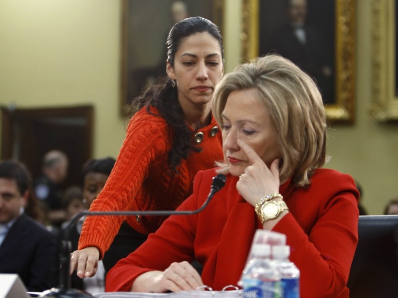 Huma Abedin, an aide to Secretary of State Hillary Clinton, hands her a note during a House Appropriations Committee hearing on Capitol Hill in Washington, March 10, 2011 (Credit: Reuters / Hyungwon Kang )