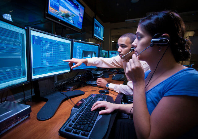 Lockheed Martin employees are seen at work in June of 2009 in the company's NexGen Cyber Innovation & Technology Center, which monitors internet threats, shortly after the facility opened, in Gaithersburg, Maryland (Credit: Reuters/Eric Schulzinger/Lockheed Martin Corp/Handout)