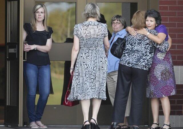 Friends and family of Constable Brian Bachmann, who was killed by a gunman while serving an eviction notice, gather at a church in College Station, Texas, August 12, 2012 (Credit: Houston Chronicle / Karen Warren)