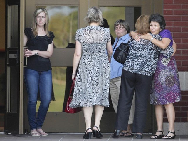 Friends and family of Constable Brian Bachmann, who was killed by a gunman while serving an eviction notice, gather at a church in College Station, Texas, August 12, 2012 (Credit: Houston Chronicle / Karen Warren)