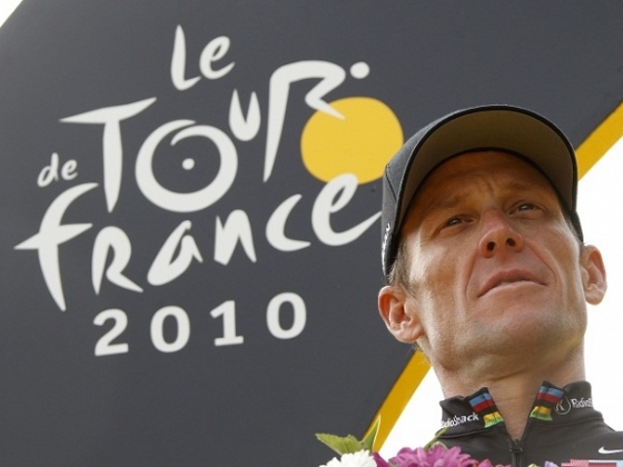 Radioshack team rider Lance Armstrong of the U.S. poses on the podium in Paris after the final 20th stage of the 97th Tour de France cycling race between Longjumeau and Paris July 25, 2010 (Credit: Reuters / Eric Gaillard)