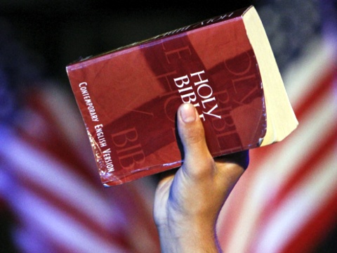 Luis Velazquez holds a bible during the America for Jesus prayer rally, Friday Sept. 28, 2012, on Independence Mall in Philadelphia. (Credit: AP)