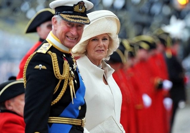 The Prince of Wales and The Duchess of Cornwall arrive on Chelsea Pier during the Diamond Jubilee River Pageant on the River Thames in London, June 3, 2012 (Credit: AFP / Bethany Clarke)