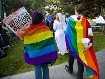 People wearing gay freedom flags participate in a protest in support of same sex marriages in San Francisco, California May 26, 2009 (Credit: Reuters/Kimberly White)