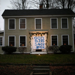 A house near the Sandy Hook elementary school has hung a sign in memory of the shooting victims over the front door (Credit: Reuters / Mike Segar)
