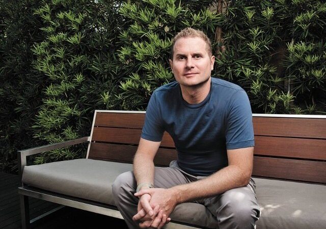 Rob Bell sitting on a bench in front of some bushes (Credit: Rob Bell via Facebook)