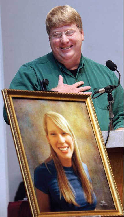 Andy Grosmaire touches his heart when talking about the love of his life, daughter Ann Grosmaire, who was shot to death. A special concert was held at the Good Shepherd Catholic Church on Sunday, November 14, 2010 to honor the life and untimely death of 19-year old Ann Grosmaire who was murdered during an April shooting (Credit: Tallahassee.com / Mike Ewen)