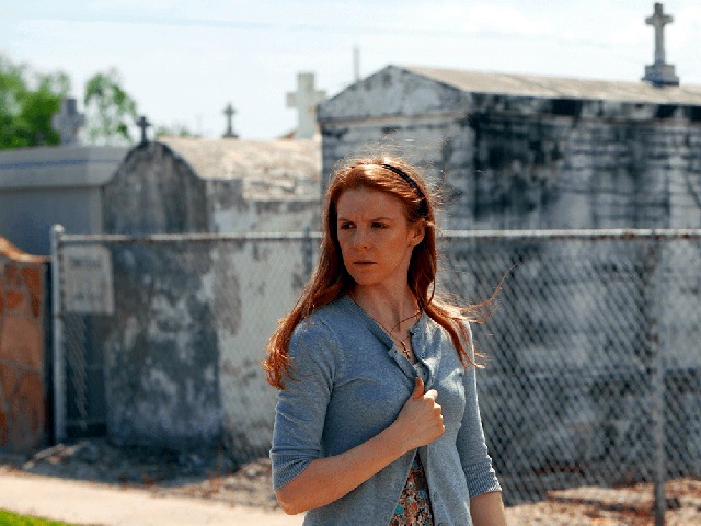 still from The Last Exorcism Part II of Ashley Bell as Nell Sweetzer walking through a cemetery (Credit: CBS Films)