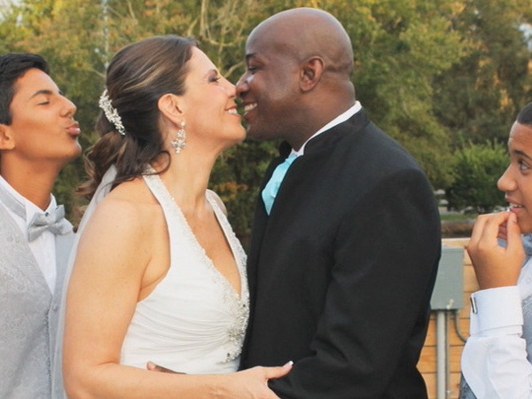 Melissa Degesso-Jones and James Jones kiss on their wedding day two years ago. Melissa Degesso-Jones, right, will donate one of her kidneys to her husband, James Jones, during transplant surgery set for Monday, Jan. 11, 2013, just a few days before the two-year anniversary of the day they met — on Valentine’s Day (Courtesy of James and Melissa Degesso-Jones) title=