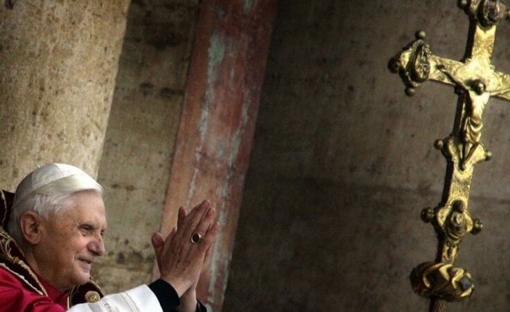 The newly elected Pope Benedict XVI, formally known as German Cardinal Joseph Ratzinger, blesses thousands of pilgrims from the balcony of the St. Peter's Basilica at the Vatican, April 19, 2005 (Credit: Reuters/Kai Pfaffenbach)