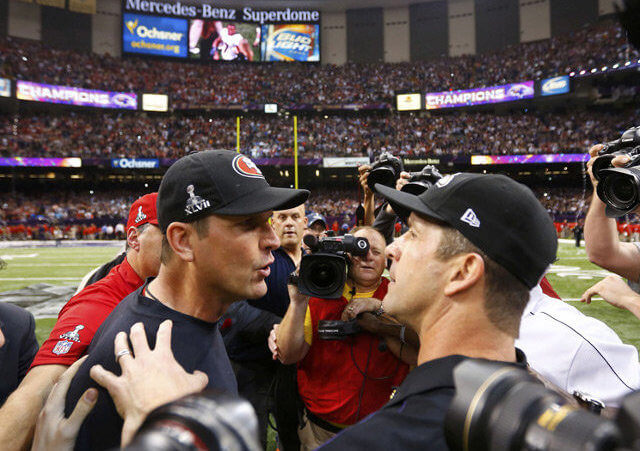 49ers head coach Jim Harbaugh congratulates his brother and Ravens head coach John Harbaugh after the Ravens defeated the 49ers to win the NFL Super Bowl XLVII football game in New Orleans (Credit: Reuters/Jeff Haynes)